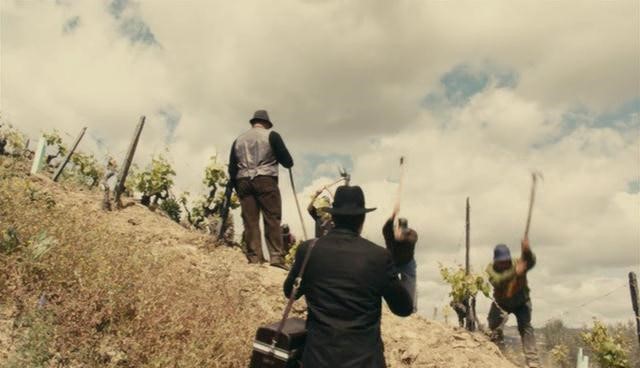 Isaac photographing the laborers
