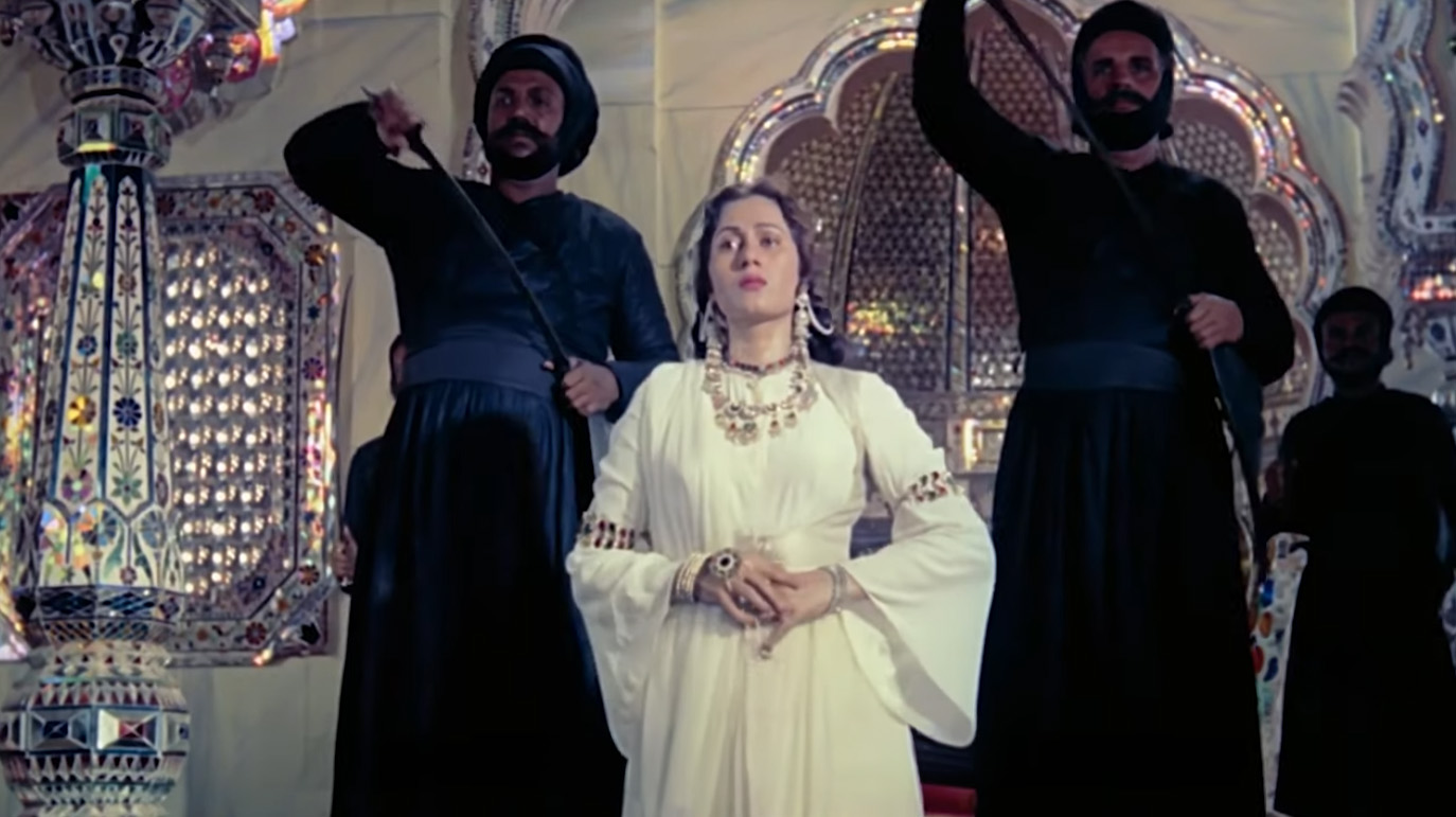 The palace guards draw their swords and lead Anarkali away