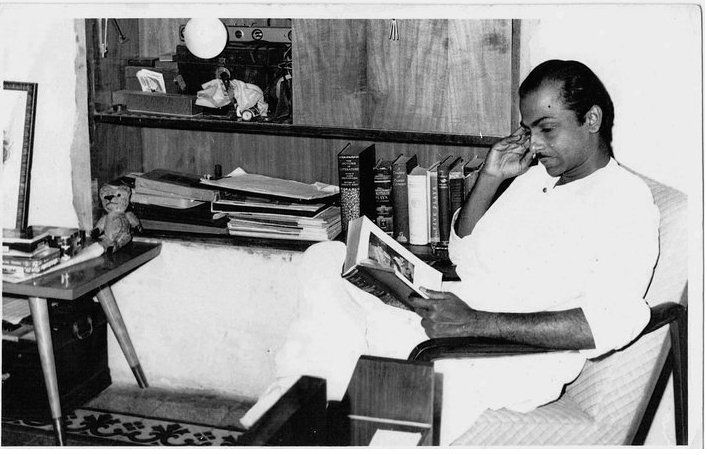 Salil Chowdhury immersed in a book 