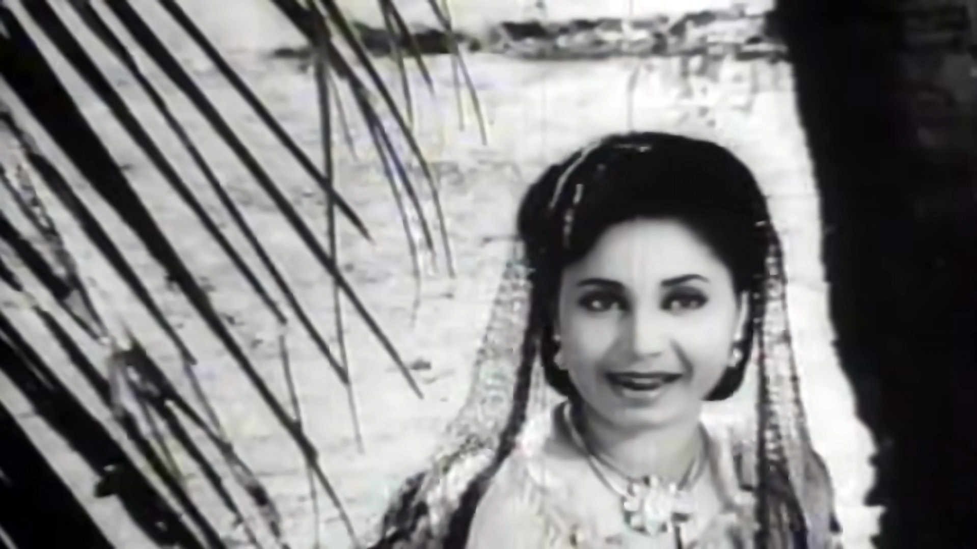 Geeta Bali briefly steps away from the crowd 