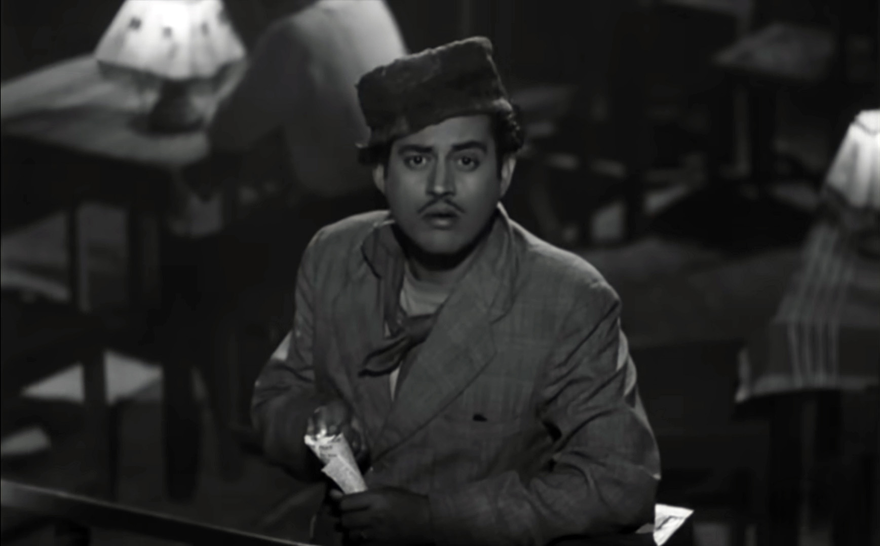 The close-up of Guru Dutt is reminiscent of Dev Anand's close-up in