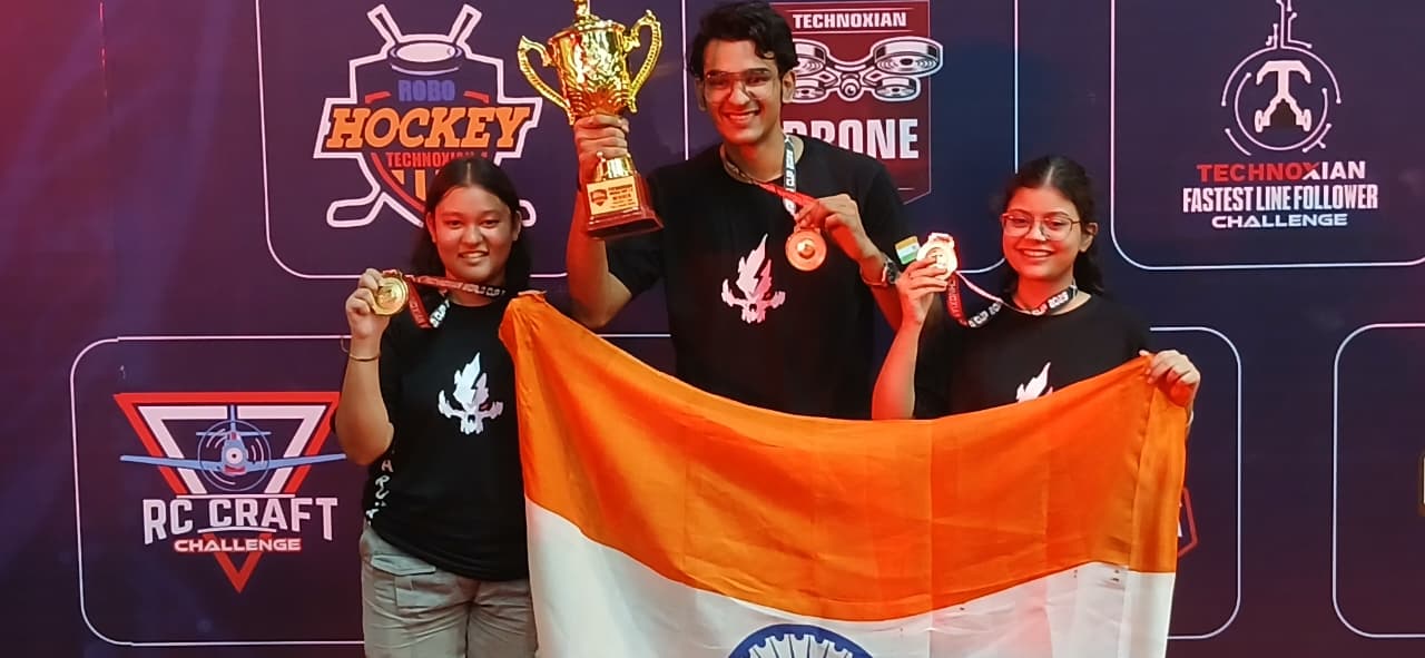 Shrutika, Ayush and Sampriti with the Fastest Line Follower trophy